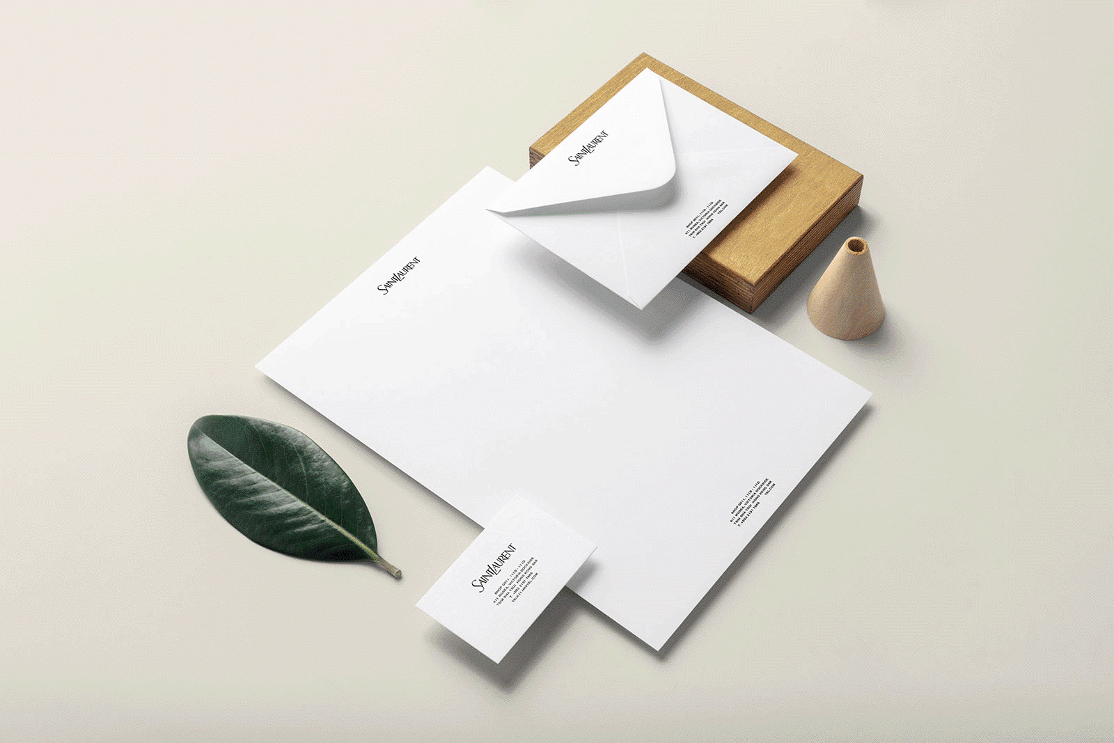A white envelope with a leaf on top of it.

Description generated by AI